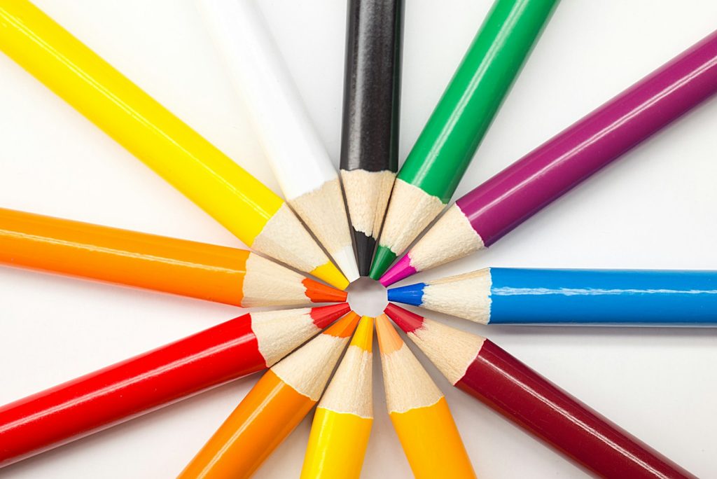 Assorted colored pencils arranged in a circle