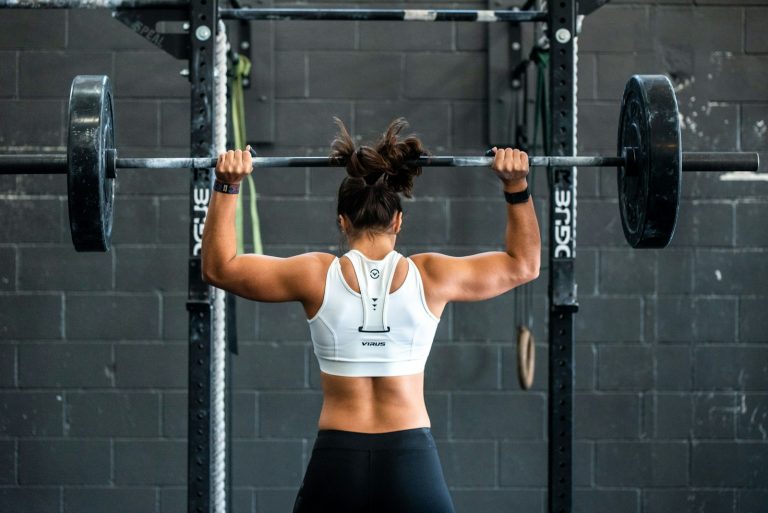 Woman weight lifting in a gym