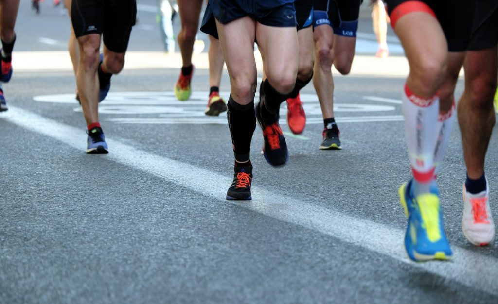 Group of runners on an asphalt road