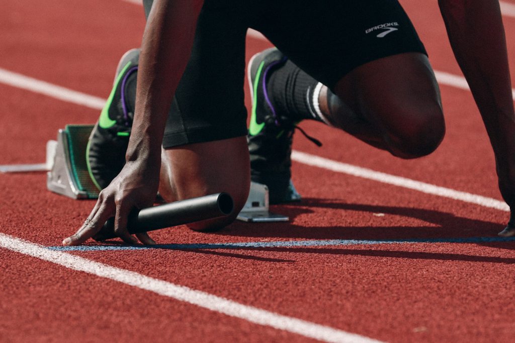 Relay runner on a running track