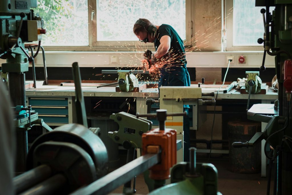 Man using an angle grinder in a workshop