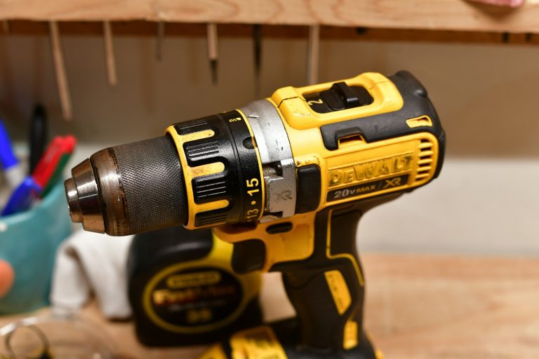 Yellow and black drill on a workbench
