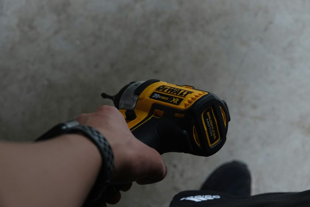 Person holding a cordless drill
