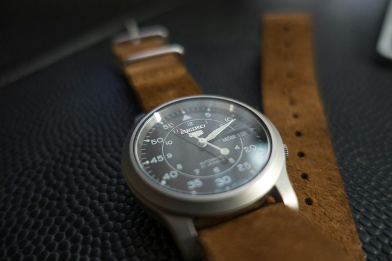 Silver watch with brown leather band