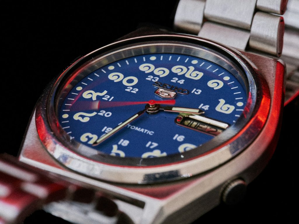 Blue-faced wristwatch with metal band