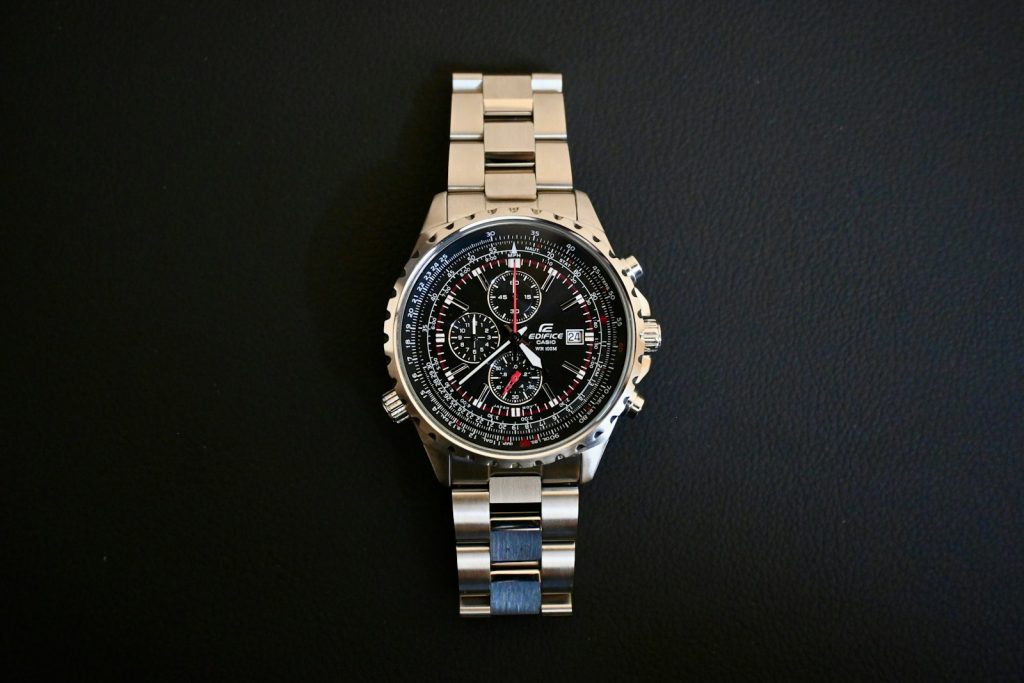 Watch resting on a metal bracelet