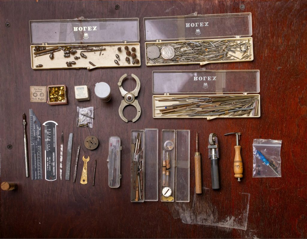 Watchmaker tools and small parts in cases