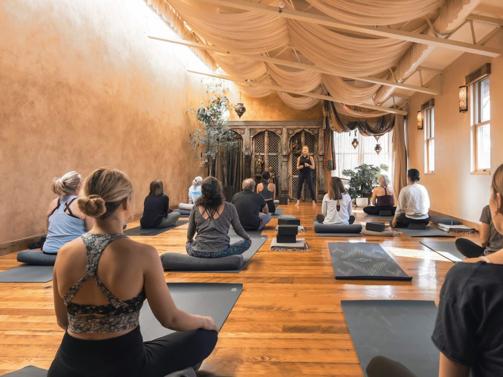 Yoga class gathered in a healing arts studio
