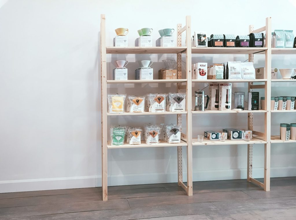 Wooden shelf with apothecary bottles and jars